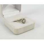 A WHITE METAL AND DIAMOND SOLITAIRE RING, the single round cut stone of approximately .85ct, claw