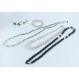 COLLECTION OF PEARL JEWELLERY, comprising peacock and white pearl necklaces, pearl bangle, pearl