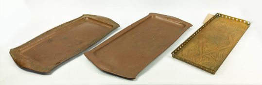 NEWLYN SCHOOL BRASS ARTS AND CRAFTS TRAY, along with two shaped copper serving trays, 54cm x 20cm W.