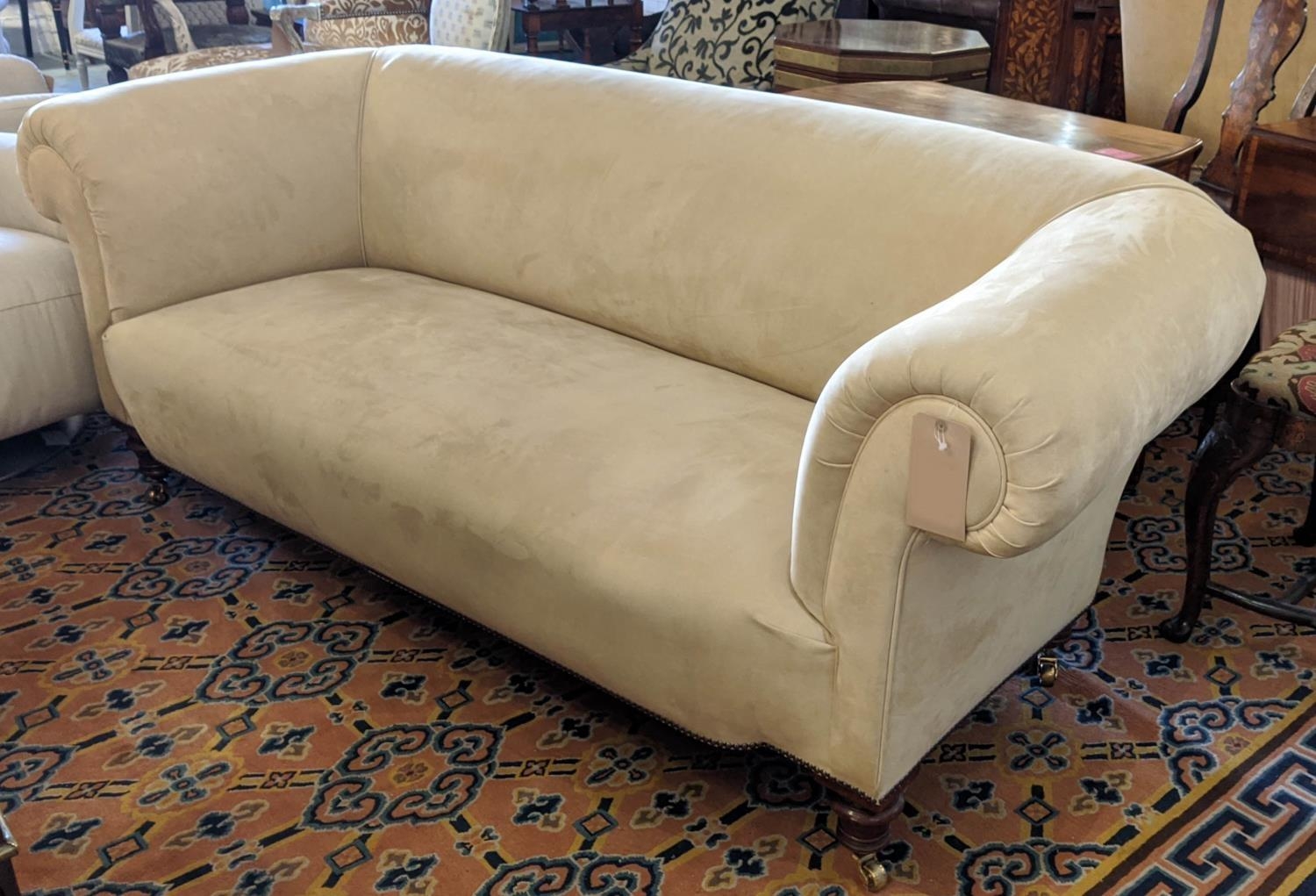 CHESTERFIELD SOFA, Edwardian with turned legs and brass castors, upholstered in suede, 200cm W.