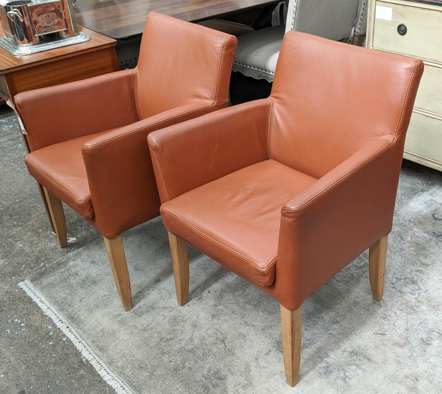 ARMCHAIRS, a pair, 86cm H tanned leather finish. (2)