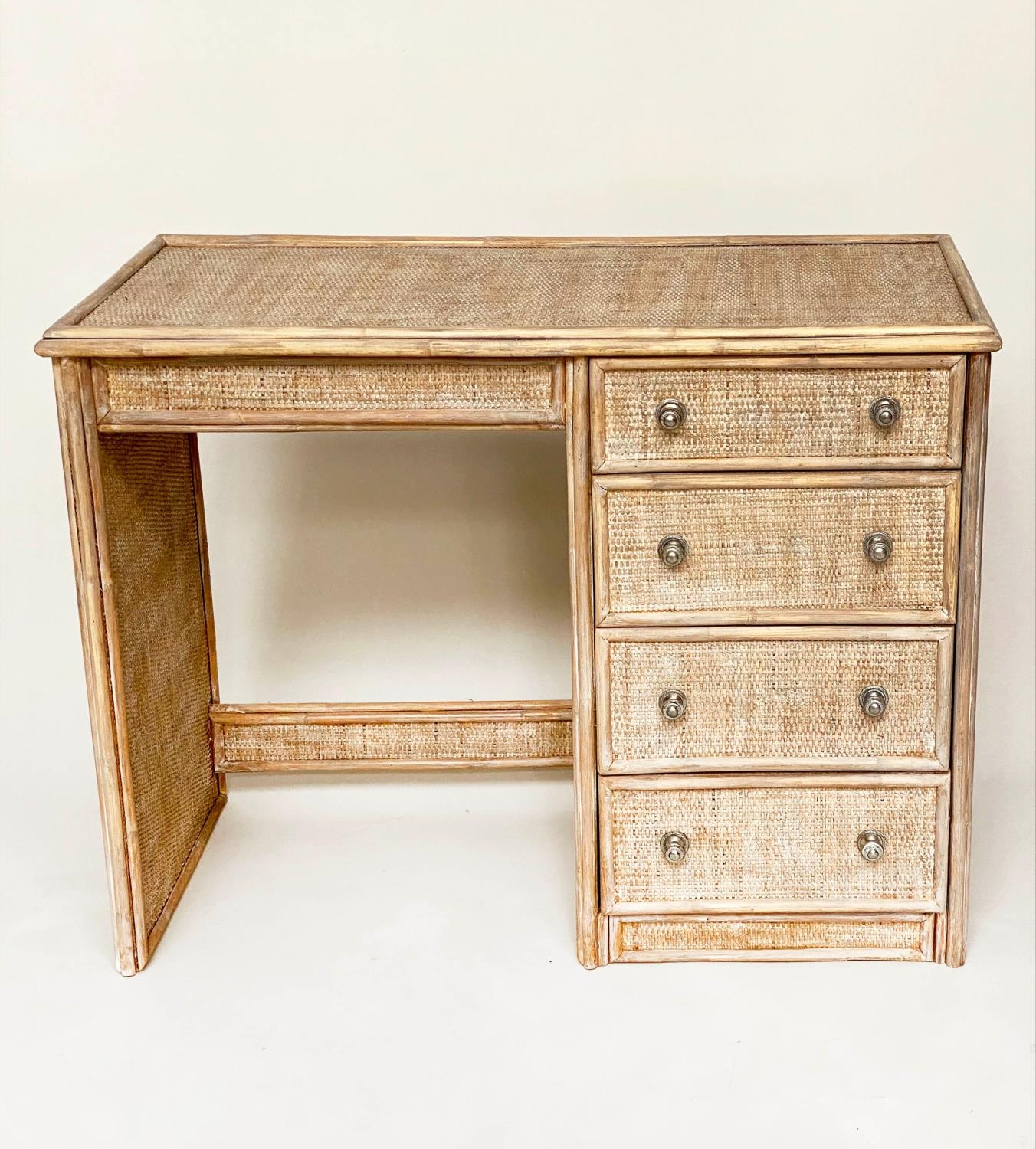 SIDE TABLE/DESK, bamboo framed and cane panelled with kneehole and four drawers, 98cm W x 44cm D x