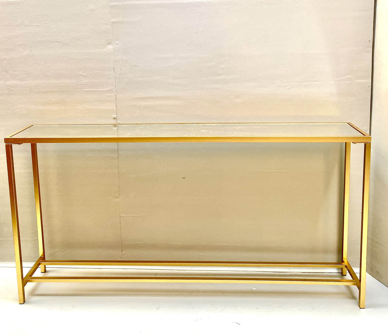 SLIM CONSOLE TABLE, gilt metal base inset glass top, 79cm x 152cm x 25cm.