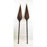 TRIBAL AFRICAN SPEARS, a pair, also employed as paddles, 162cm L. (2)