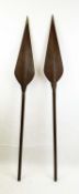 TRIBAL AFRICAN SPEARS, a pair, also employed as paddles, 162cm L. (2)