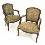 FAUTEUILS, 81cm H x 63cm W, a pair, 19th century French walnut, in old floral covers. (2)