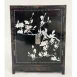 SIDE CABINET, Chinese black lacquered and mother of pearl inset depicting birds of paradise with two