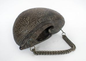 COCO DE MER, 19th century Islamic carved half nut, decorated with Islamic script calligraphy and