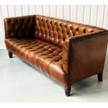 SOFA, William IV mahogany in deep buttoned faded tan leather with reeded supports, 203cm W.