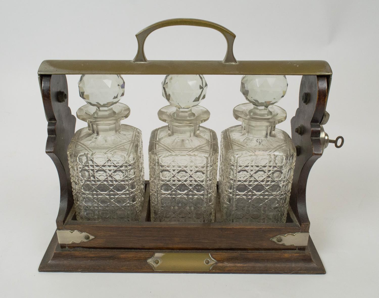 TANTALUSES , two, one Victorian oak, with silver plated mounts and three cut glass decanters - Bild 4 aus 6