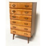 MEREDEW TALL CHEST, 65cm x 48cm x 144cm, 1960s polished figured elm, with six shaped drawers and