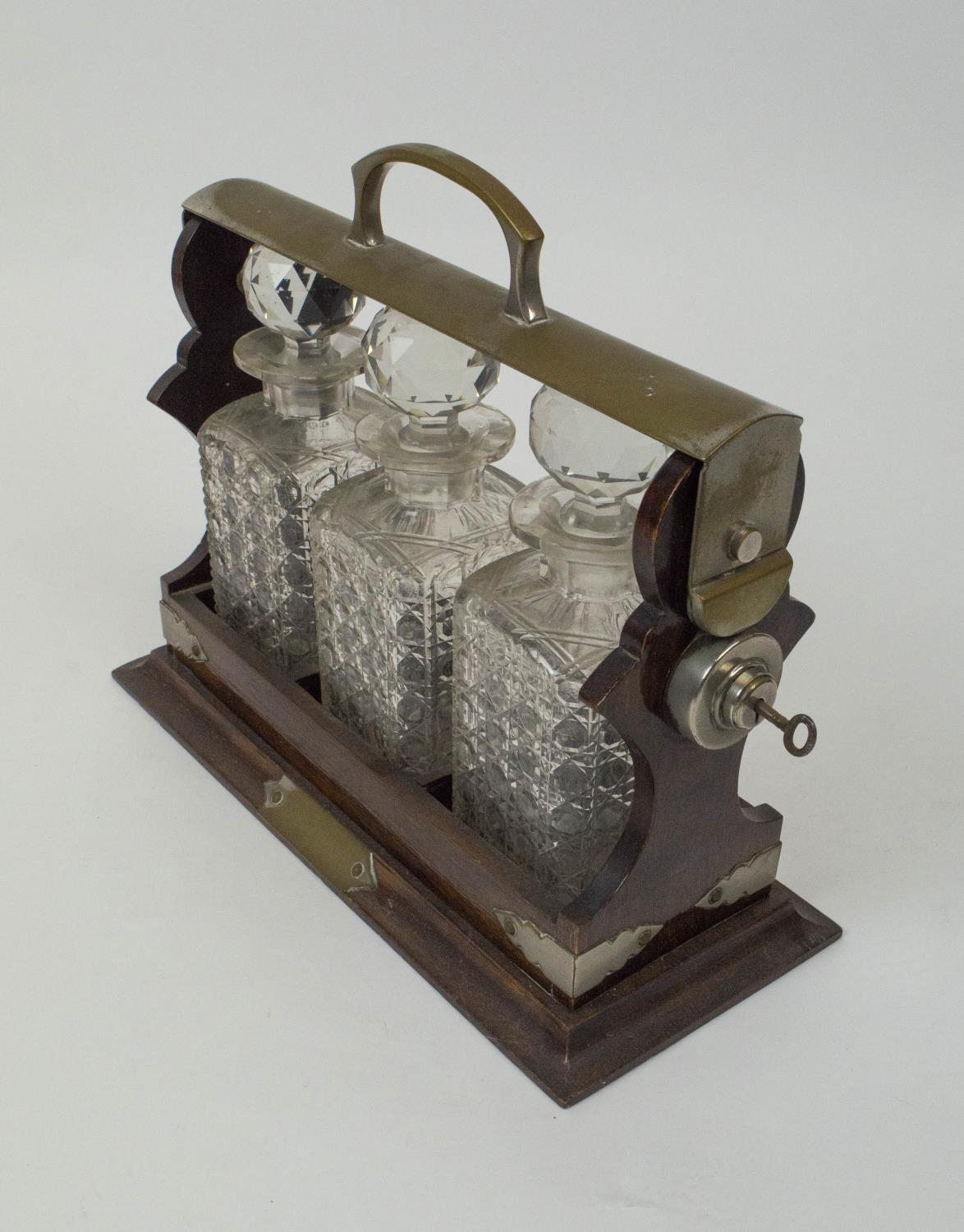 TANTALUSES , two, one Victorian oak, with silver plated mounts and three cut glass decanters - Image 3 of 6