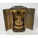 TRAVELLING SHRINE, 19th century Japanese black and gilt lacquer, having hinged doors, opening to
