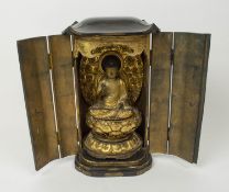 TRAVELLING SHRINE, 19th century Japanese black and gilt lacquer, having hinged doors, opening to