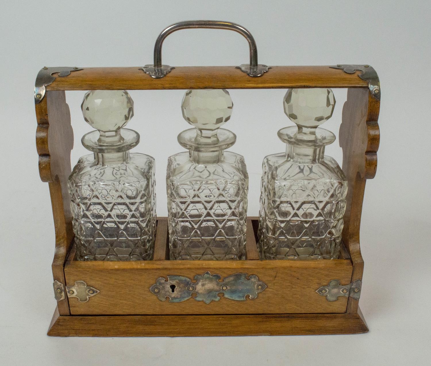 TANTALUSES , two, one Victorian oak, with silver plated mounts and three cut glass decanters - Bild 5 aus 6