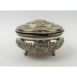 OTTOMAN SILVER REPOUSSE LIDDED BOX, with repeat rosette foliate patterned decoration, Egyptian