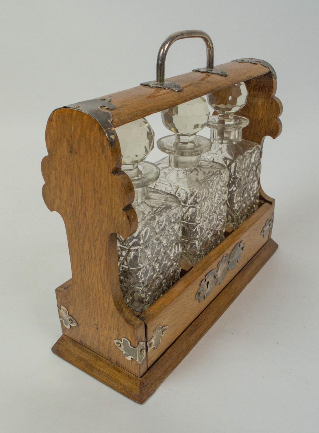 TANTALUSES , two, one Victorian oak, with silver plated mounts and three cut glass decanters - Bild 6 aus 6