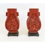 VASES, a pair, Chinese Cinnebar style Hu form on carved wooden stands, 35cm H. (2)