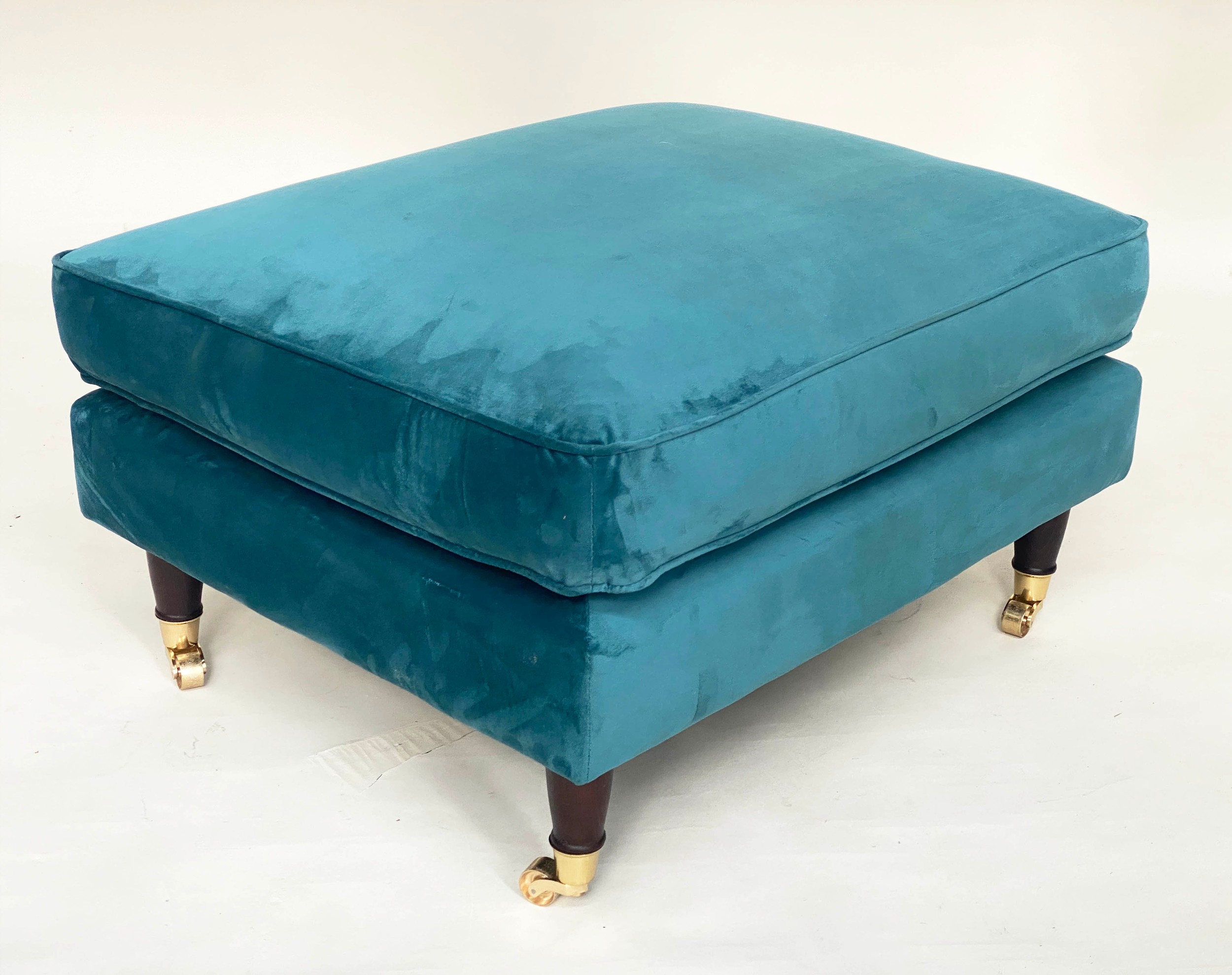 FOOTSTOOL, contemporary ocean blue velvet upholstered, turned supports with gilt metal castors, 76cm