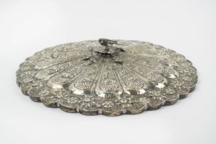 OTTOMAN SILVER REPOUSSE MIRROR, with foliate decoration and mounted bird, 28cm diam.