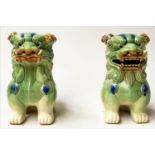 DOGS OF FOO, a pair, Chinese green and brown ceramic, 25cm H. (2)