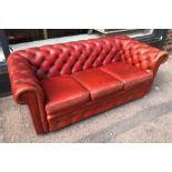 CHESTERFIELD SOFA, mid 20th century, rouge leather, 67cm H x 180cm W x 85cm D.