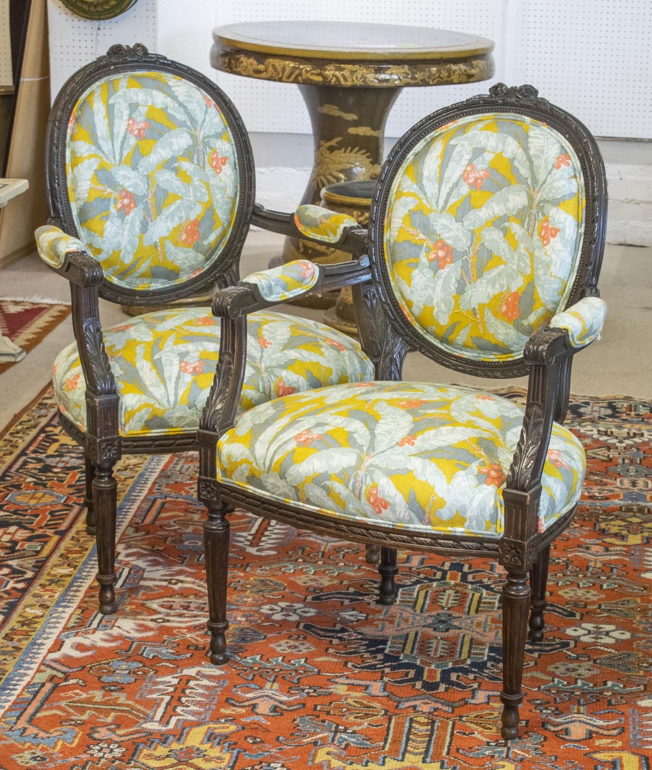 FAUTEUILS, 92cm H x 60cm, a pair, early 20th century French stained beech in new leaf patterned