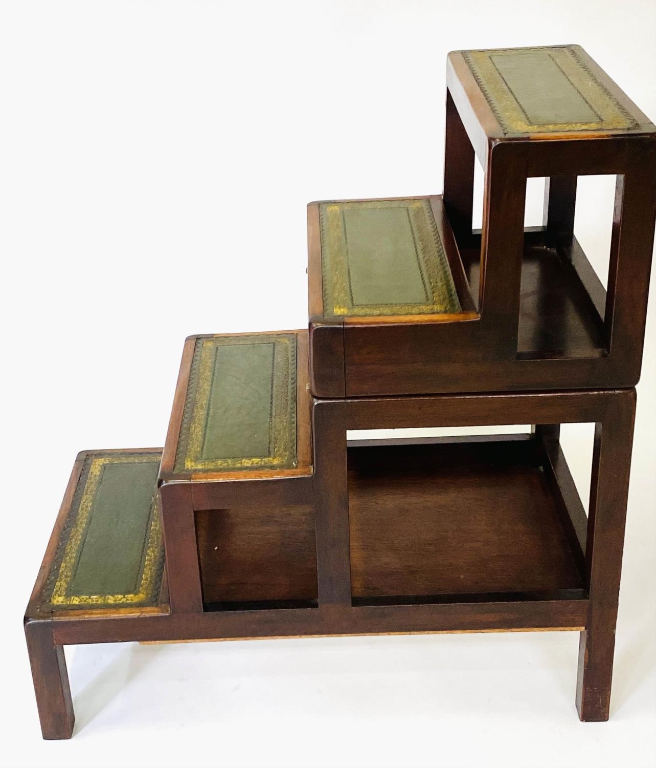 METAMORPHIC LIBRARY STEPS, George III style, a set of four gilt tooled leather tread steps