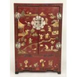 CHINESE SIDE CABINET, early 20th century scarlet lacquered and gilt chinoiserie decorated with two