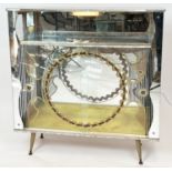 COCKTAIL CABINET, circa 1950s, mirrored and etched glass with sliding doors and light up interior,