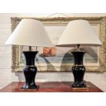 TABLE LAMPS, a pair, each 75cm H including shades, black metal with polished brass detail, 92cm x