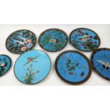 CLOISONNE PLATES, a group of seven, all depicting birds amongst flowers blue ground of various