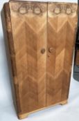 ART DECO WARDROBE, feathered oak and burr walnut with two doors and fitted and hanging interior,