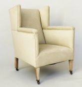 WING ARMCHAIR, Edwardian parchment weave upholstery with tapering supports, 66cm W.
