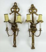 WALL LIGHTS, a pair, 19th century carved giltwood with bow ribbon tops above eagles and twin