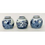 CHINESE JARS, a set of three Chinese blue and white ceramic lidded jar form, 25cm H. (3)