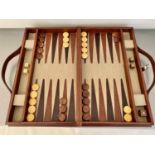 BACKGAMMON SET, in a leather case, 23cm x 40cm.