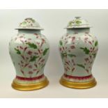 CHINESE LIDDED TEMPLE VASES, a pair, inverted baluster form, hand painted in red and green