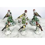 BOW PORCELAIN GOLDFINCHES, a pair, 18th century, 12cm H, together with four other 18th century
