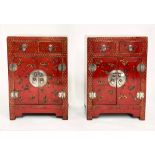 CHINESE CABINETS, a pair, scarlet lacquered and gilt Chinoiserie decorated each with two drawers and