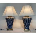 FISH TABLE LAMPS, a pair, ceramic white on blue ground tapering vase form and metal base with shade,
