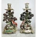 CHELSEA PORCELAIN FABLE CANDLESTICKS, a pair, circa 1765, one depicting a fox and a goat, the