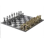 CHESS SET, with oversized gilt and silvered pieces, the board 60cm square.