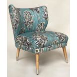 COCKTAIL CHAIR, contemporary turquoise blue ground and floral abstract printed with metal capped