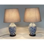 TABLE LAMPS, 75cm H, a pair, Chinese blue and white ceramic of vase form with circular wood bases