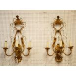 WALL SCONCES, a pair each 64cm H x 40cm W gilt metal with glass droplets. (2)