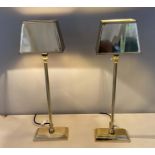 LIBRARY LAMPS, a pair, 60cm H x 18cm W x 13cm D, gilt metal, with shades.
