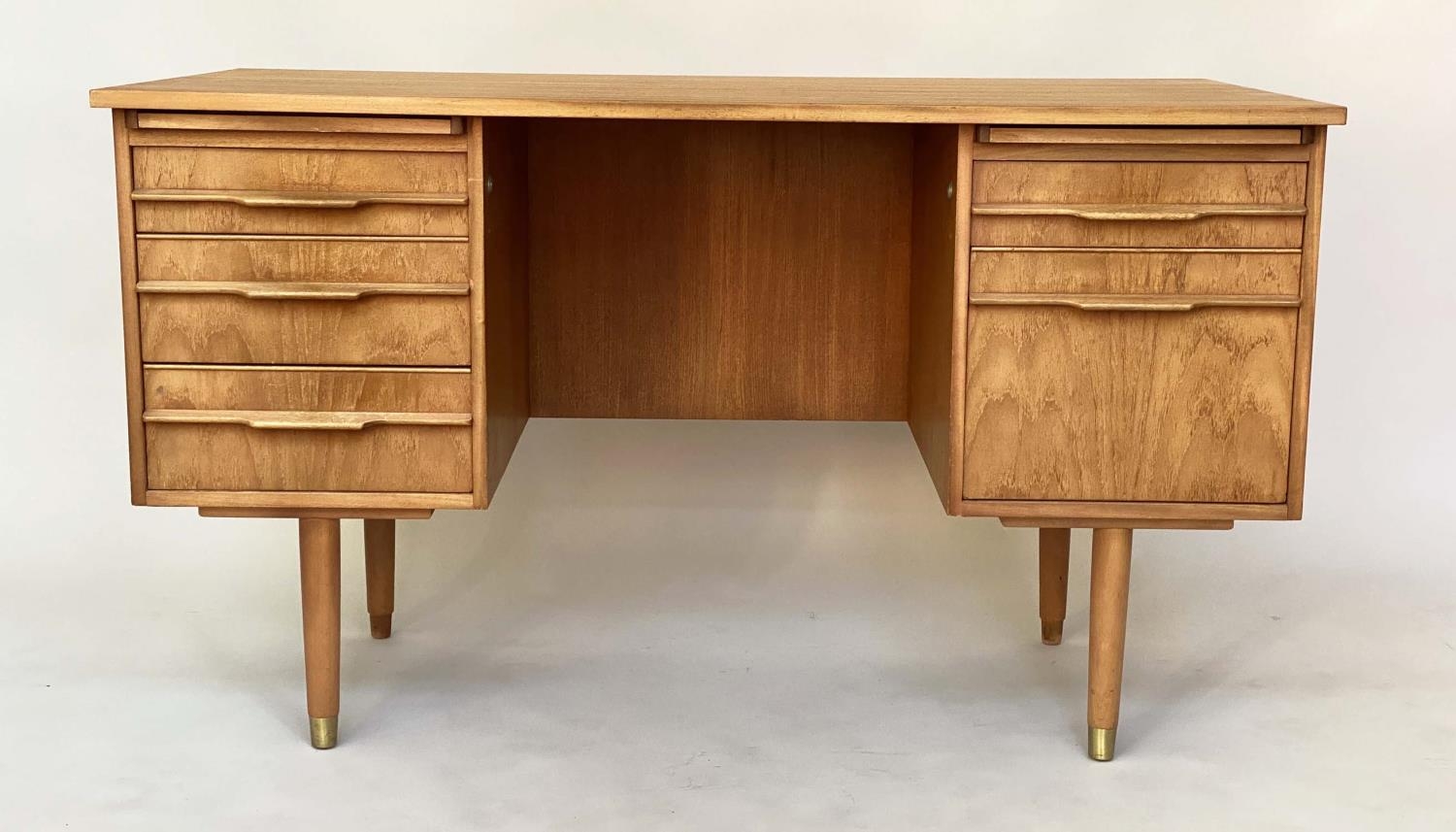 DANISH DESK, mid 20th century teak with twin pedestals on legs with slides and five drawers, 130cm x