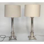 TABLE LAMPS, a pair, silvered columns stepped with plinth and paw supports with shades, 80cm H. (2)
