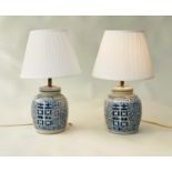 TABLE LAMPS, a pair Chinese ceramic blue and white lidded jar form, geometric panels with shades,